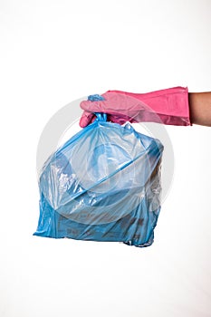 Hand holding trash bag