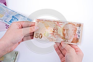 Hand holding Turksh Lira banknote in hand photo