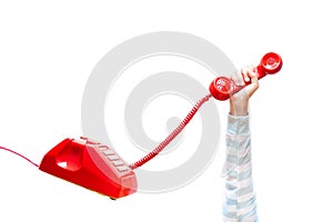 Hand holding up red telephone