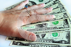 Hand holding US dollars isolated on the white