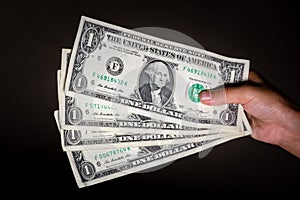 Hand Holding US Dollars