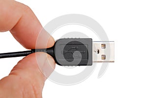 Hand holding USB cable