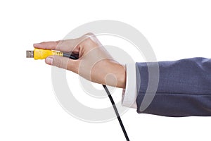 hand holding USB cable.