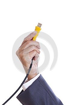 hand holding USB cable.