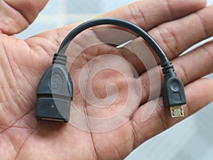 hand holding a usb cable