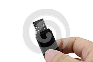 Hand holding USB flash drive