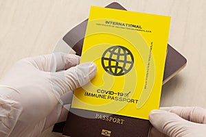 Hand holding vaccine passports as proof that the holder has been vaccinated against Covid-19, Requirement for international travel