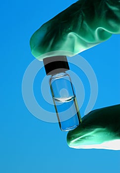 Hand Holding Vial photo