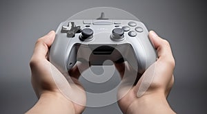 hand holding video controller, close-up of hand holding gamepad, gamer playing game with gamepad