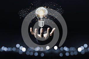 Hand holding the virtual light bulb with brain. Creative new business idea concept