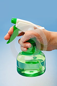 Hand holding water sprayer