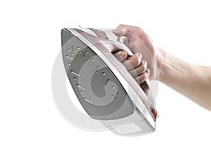 Hand holding a white brown electric iron. Close up. Isolated on a white background