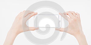 Hand holding white cellphone isolated on white clipping path inside. Online shopping. Top view. Mock up. Copy space. Template.Blan