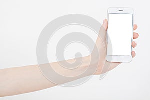 Hand holding white cellphone isolated on white clipping path inside. Online shopping. Top view. Mock up. Copy space. Template.Blan