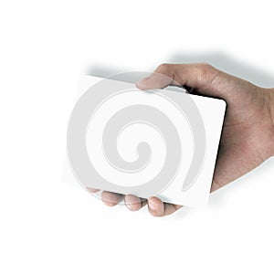 Hand holding white paper