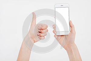 Hand holding white phone isolated on white clipping path inside. Top view.Mock up.Copy space.Template.Blank.