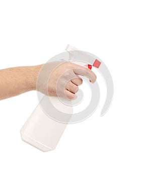 Hand holding white plastic spray bottle.