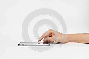 Hand holding white smart phone, playing games