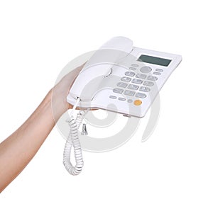 Hand holding white telephone