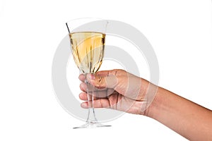 Hand holding white wine in crystal glass and ready to toast