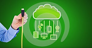 Hand holding wire connection with cloud devices