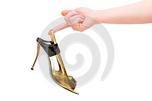 Hand holding woman shoe