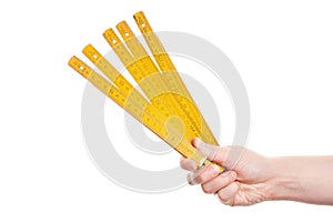 Hand holding wooden folding ruler