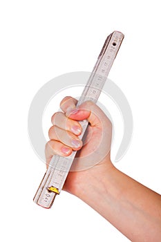 Hand holding wooden folding ruler on white background