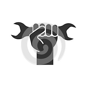 Hand holding wrench glyph icon