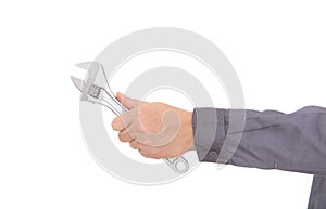 A hand holding a wrench tool in front of white backgroun