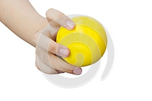 Hand holding yellow stress ball