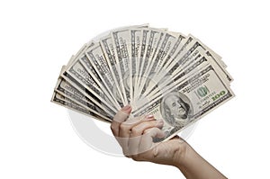 the hand holds 100 dollar bills. A woman's hand holds a fan of dollars on an isolated white background. Finance
