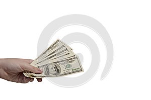 the hand holds 100 dollar bills. A womans hand holds a fan of dollars on an isolated white background. Finance