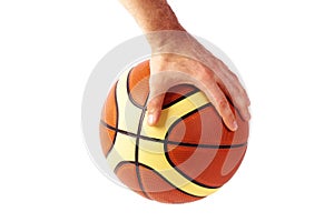 Hand holds basketball ball isolated on white background