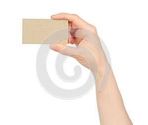 Hand holds blank business card on white background