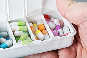 Hand holds box with medical pills