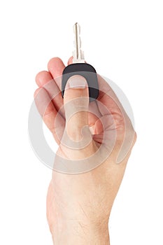 Hand holds car key