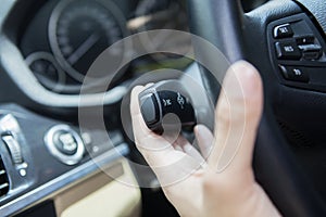 Hand holds a car knob