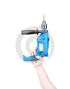 Hand holds cordless electric screwdriver with bit for screws isolated on white background
