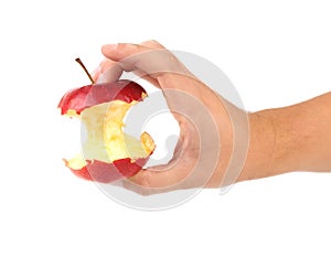 Hand holds core of an apple.