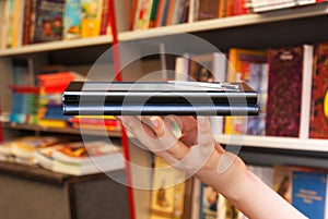Hand holds electronic book reader