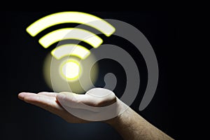 Hand holds a glowing lifi symbol