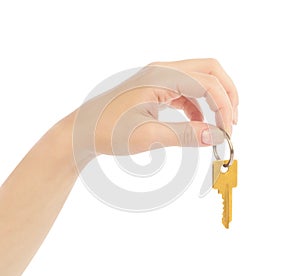 Hand holds a gold key