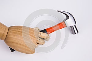 Hand holds a hammer