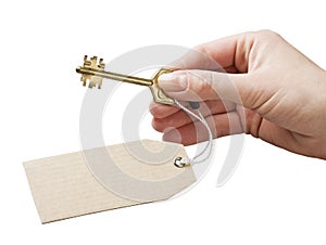 The hand holds a key with a label