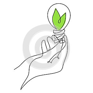 Hand holds light bulb with leafs,one line art,hand drawn continuous contour.Green energy idea concept.Sign of environmental