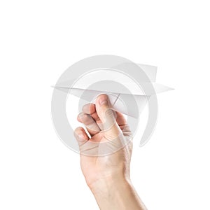 The hand holds a paper airplane. Close up. Isolated on a white background