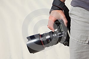 Hand holds photo camera