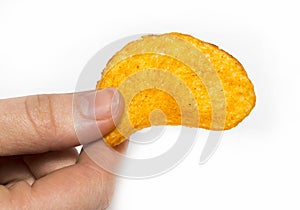 Hand holds potato chips. Isolated on a white background.