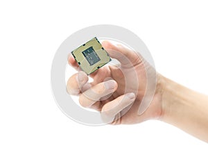 The hand holds a powerful desktop processor. Close up. Isolated on a white background